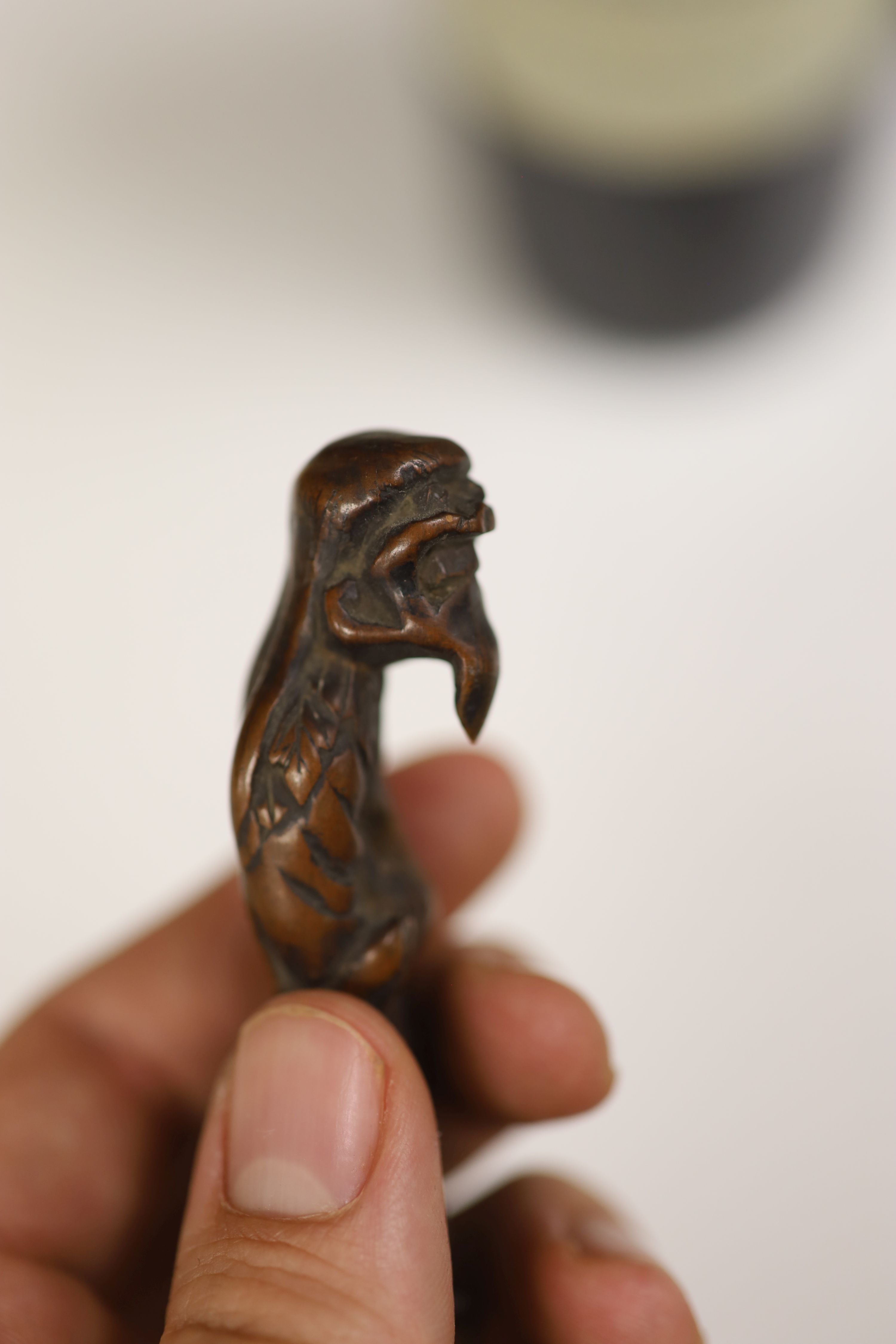 A small miscellaneous Oriental collection including enamel snuff boxes, Buddha carvings etc.